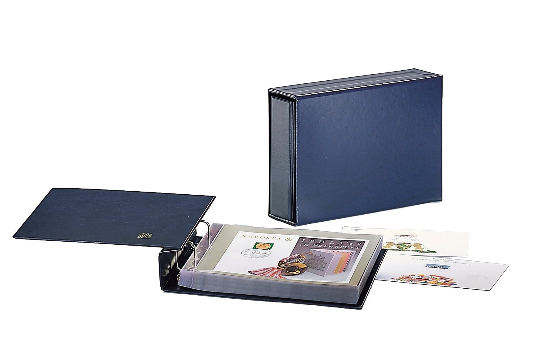 Open blue stamp album with a collection of covers and a closed blue album with slipcase on a white background