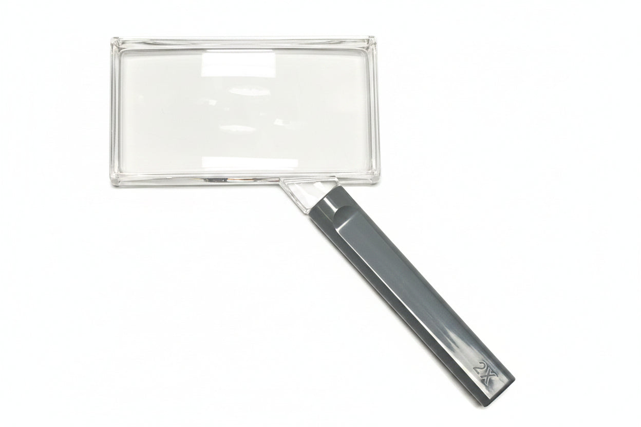 Rectangular magnifying glass with gray handle on a white background