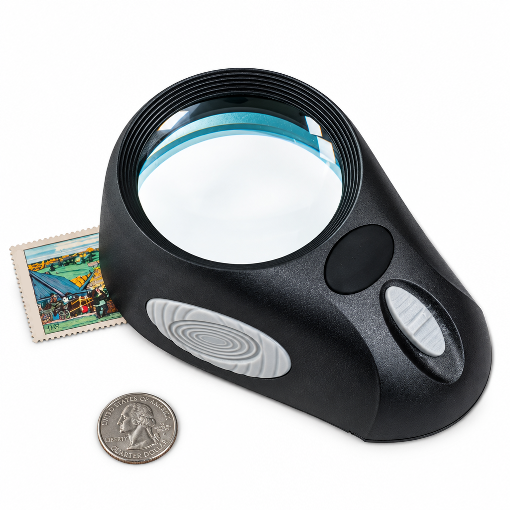 A black hands-free magnifying glass with a large circular lens, shown on a white background with a postage stamp and a coin for scale.