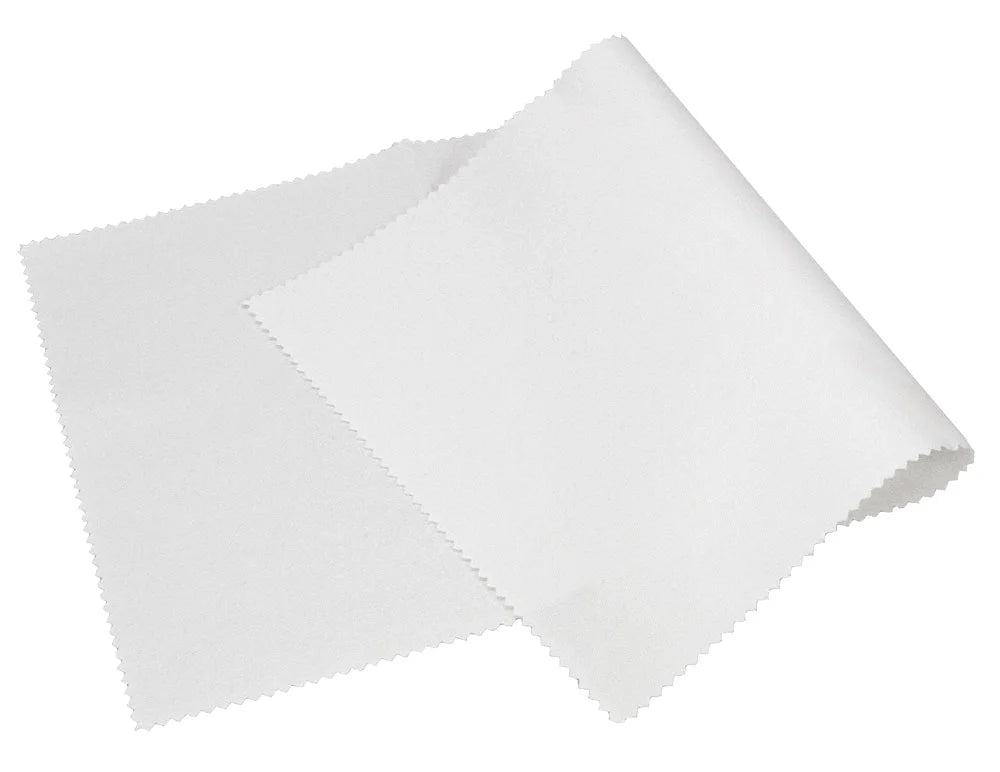 A white stamp drying replacement cloth with serrated edges, overlapping itself on a solid white background.