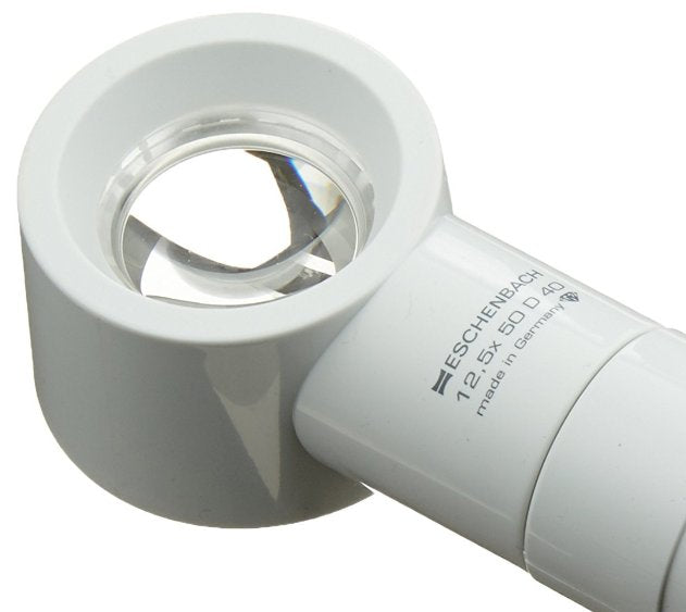 Head of eschenbach brand magnifying glass with white frame and black accents on a white background