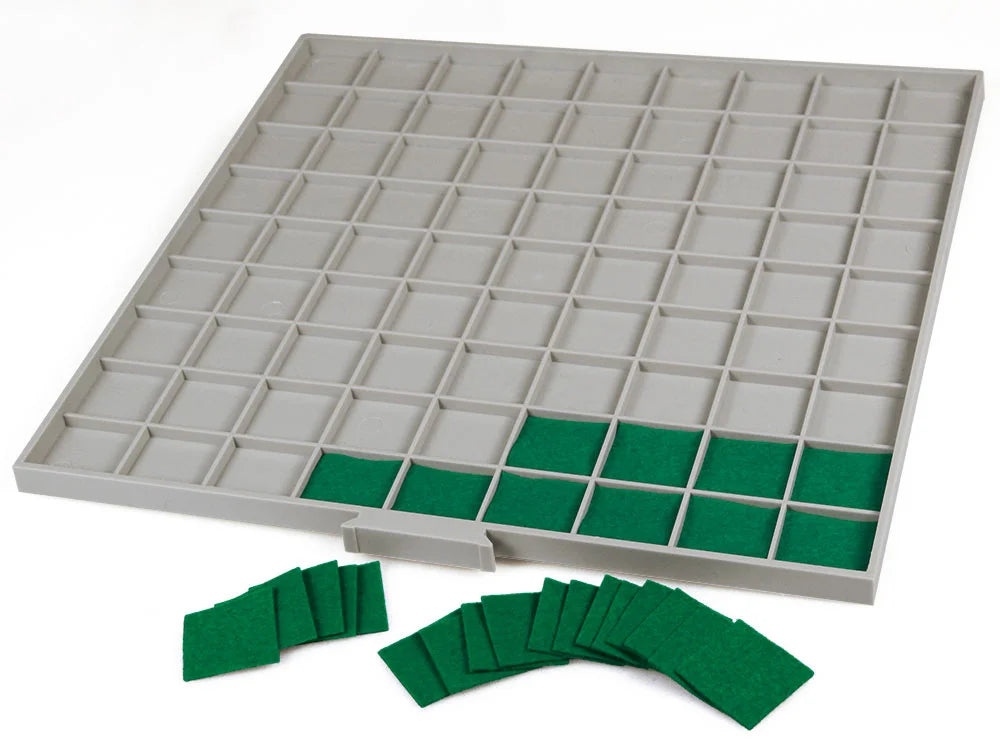 Gray grid tray drawer with red felt inserts on a white background