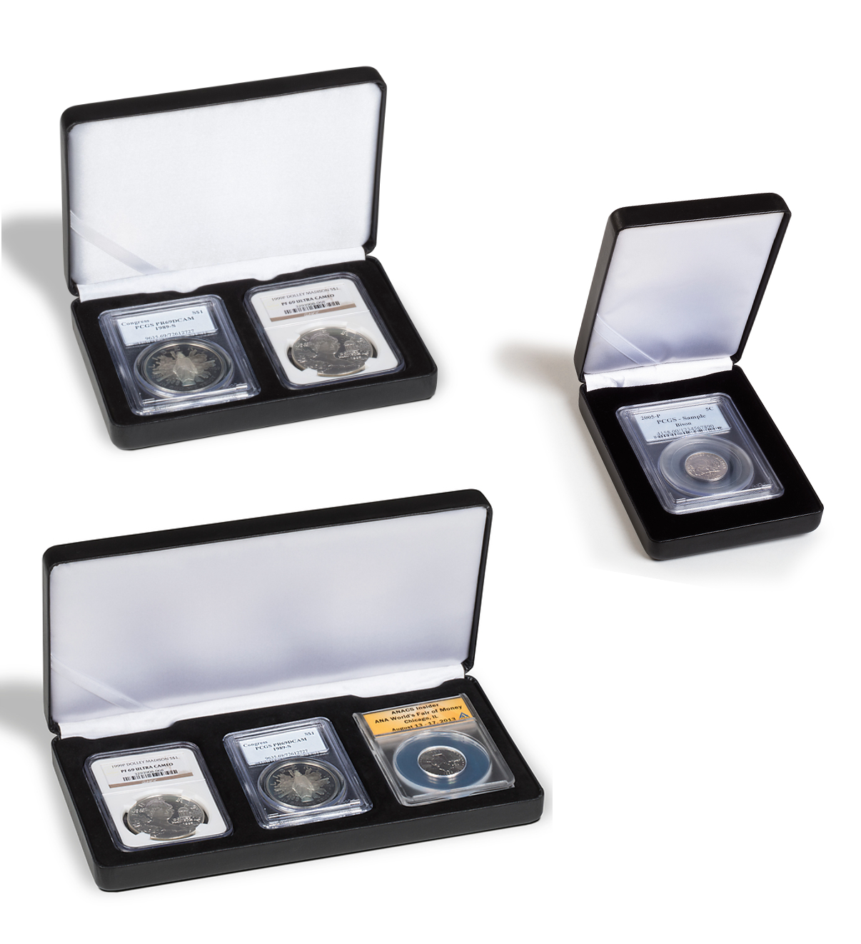 Three open coin cases displaying graded coin slabs on a white background
