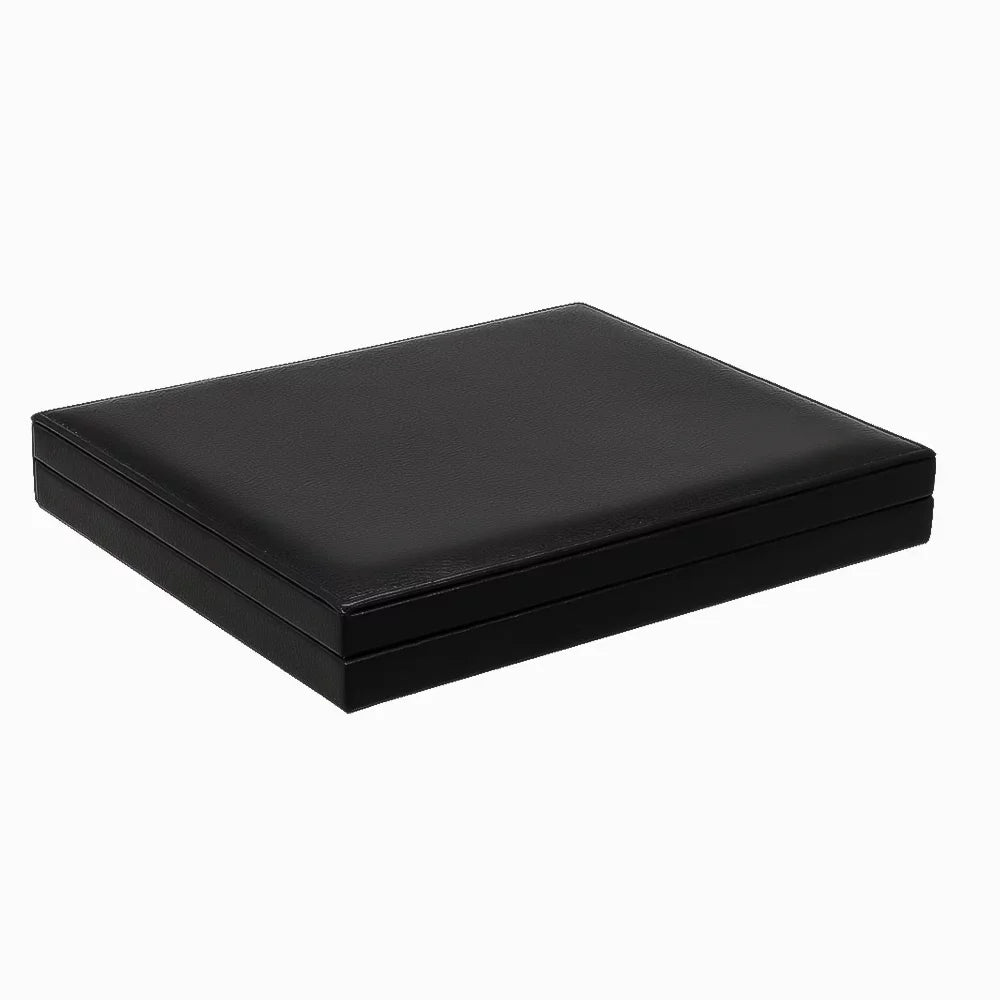 Closed black leather coin presentation case, on a white background.