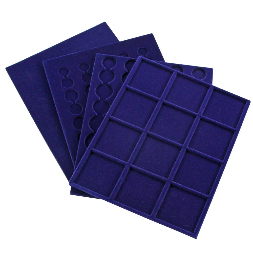 Set of blue velvet coin trays with round & square compartments spread out on a white background