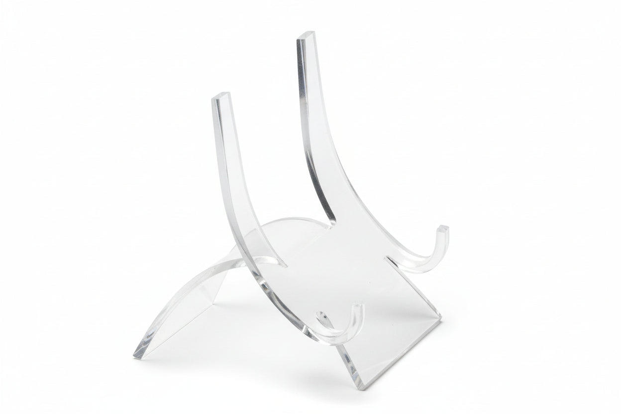 Clear acrylic curved back easel for collectibles on a white background